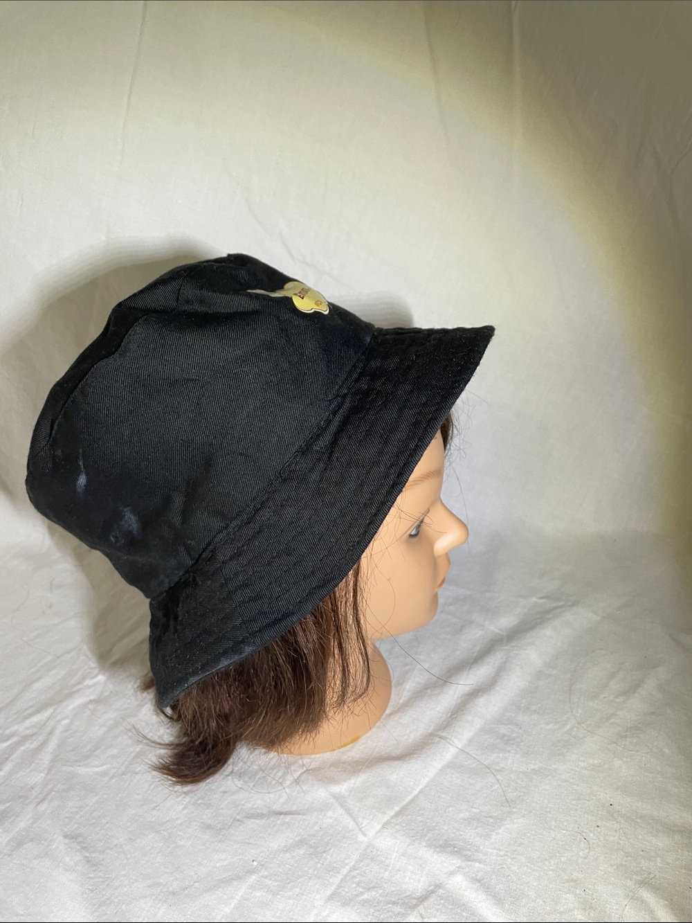 Black Bucket Hat with Small Gold Badge - Women's Accessory